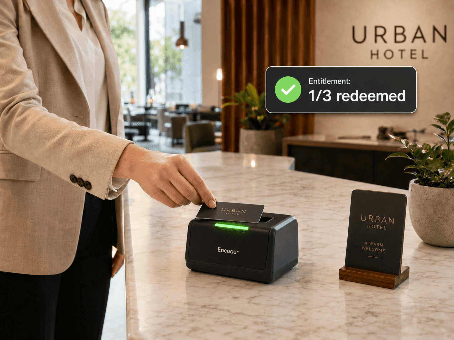 Guest tapping a room key at the tablet as the entitlement result appears